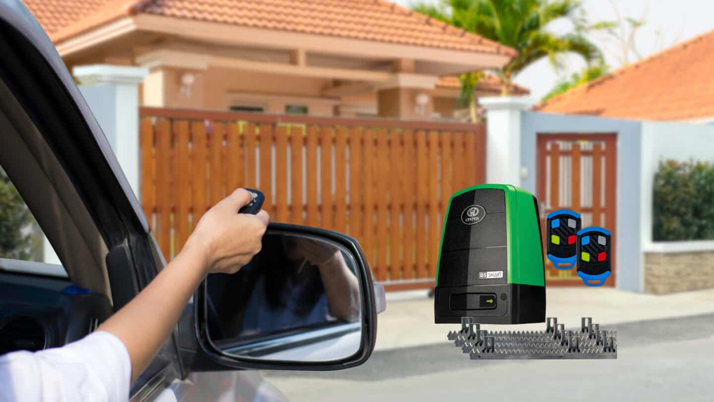 man in a car using a remote to open his gate